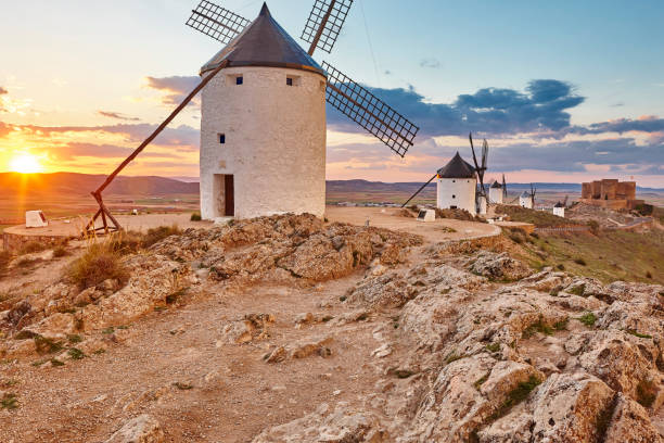 istock Traditional antique windmills at sunset in Spain. Consuegra, Toledo 1181784143