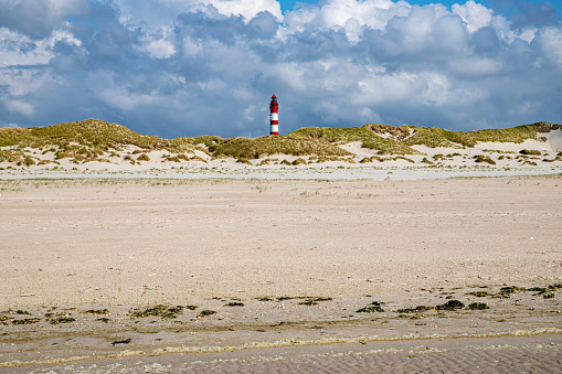 Amrum lighthouse behind dunes