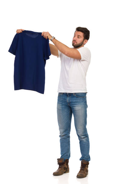 istock Surprised Man Is Showing Blue T-Shirt 1181786017