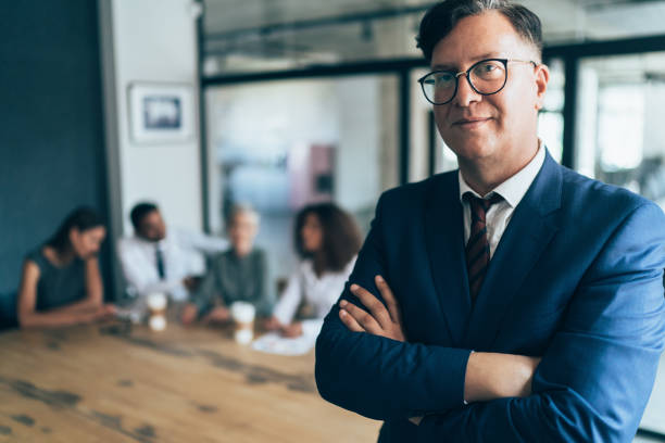 Experience and confidence Portrait of Mid-adult businessman at the office executor role stock pictures, royalty-free photos & images