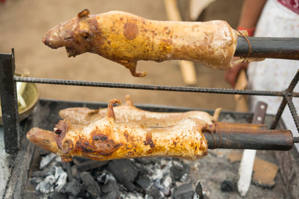 Roasting guinea pigs on BBQ and selling the food on street. Almost ready to eat outdoors, Ecuador.