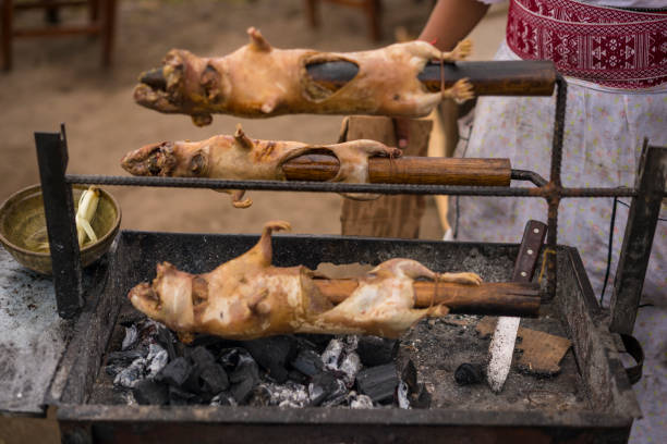 Roasting guinea pigs on BBQ and selling the food on street. Almost ready to eat outdoors, Ecuador.