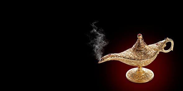 Image of magical mysterious aladdin lamp with  smoke. Dark background