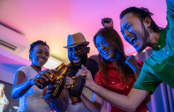 Young people having fun and happy dancing at party. stock photo
