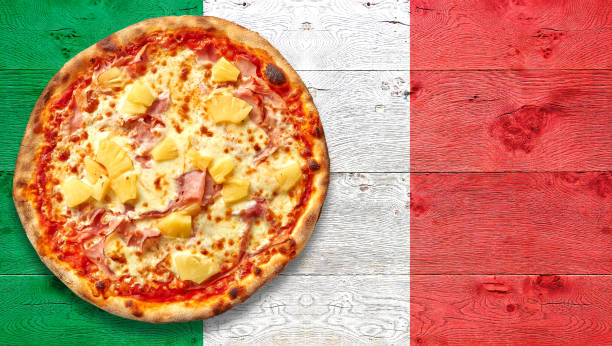istock Italy flagged wooden Table with Hawai pizza on plate. 1181796079