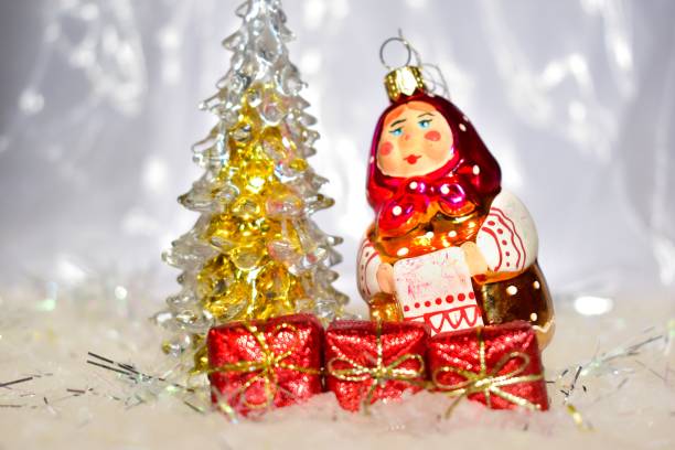 istock Christmas toys and decorations on a snowy background. 1181800626
