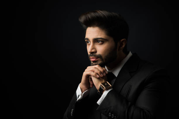 istock Indian Male businessman standing over black background 1181800749