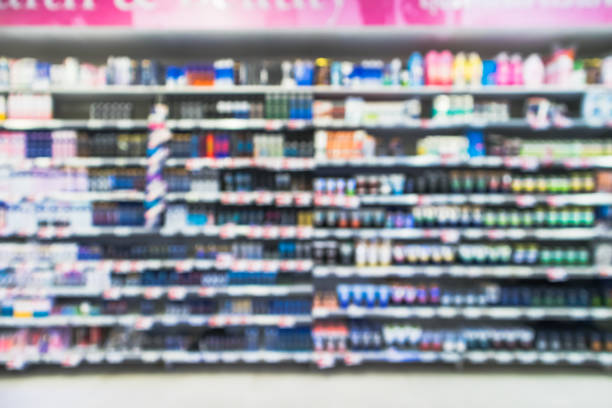 blur colorful cosmetic product,body spray,facial cleansing foam,roll on and skin lotion - department store shopping mall store inside of imagens e fotografias de stock