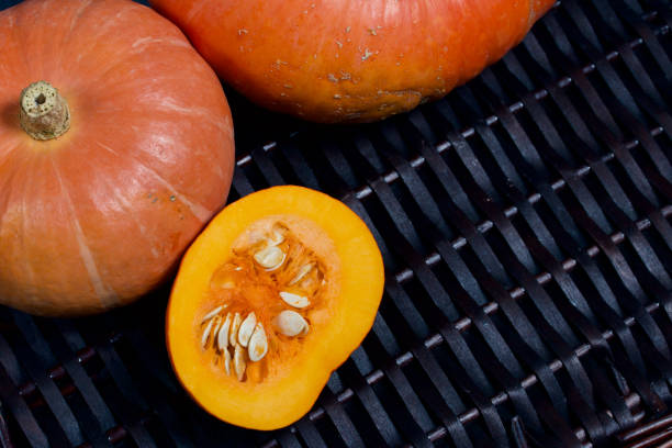 istock Ripe orange pumpkins. They lie on different surfaces. 1181806605