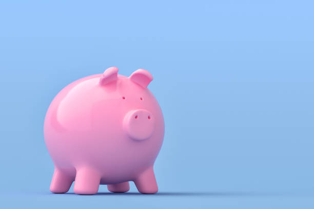 istock Piggy Bank on blue background 1181807464