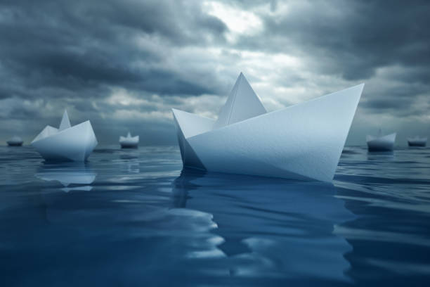 istock Paper Boats on Sea 1181807465