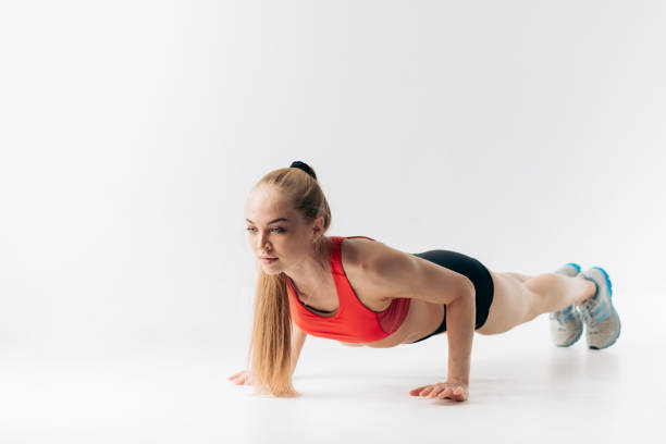 istock good looking pleasant girl is spending time at gym 1181810617
