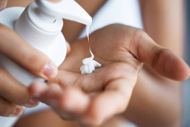 istock Woman hands applying a moisturizing hand lotion 1181811612
