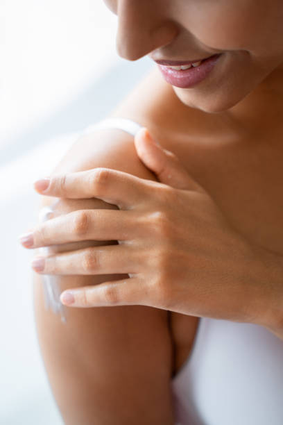 istock Contented woman putting on a body cream 1181811672