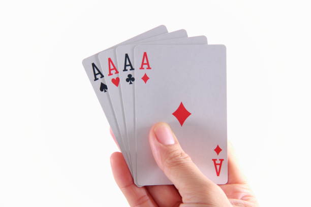 istock Four aces playing cards in hand 1181814529
