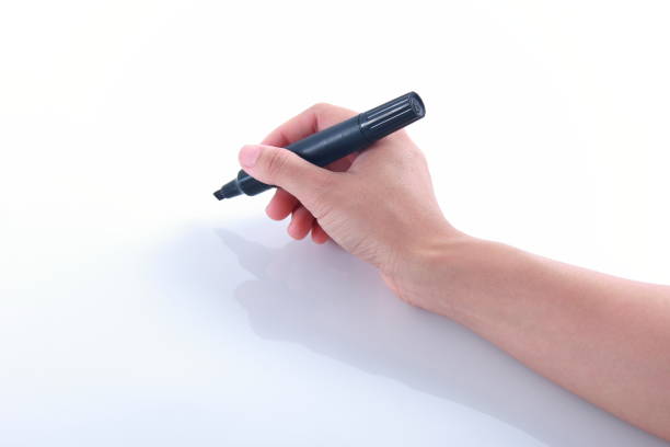 istock Woman hand writing with a marking pen 1181814533