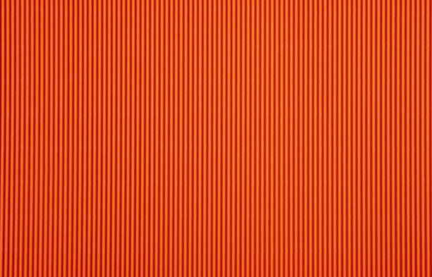 istock Orange color corrugated paperboard texture and background 1181814559