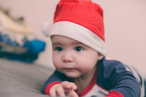 istock Little Boy In Santa Hat 1181816838