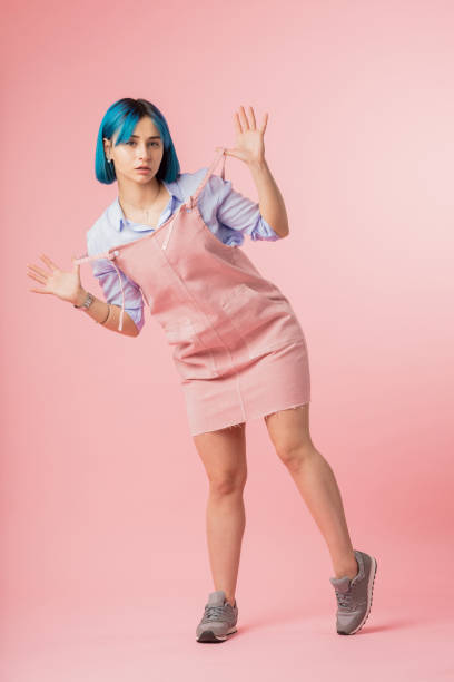 istock attractive girl performing experiments with her appearance and clothes. 1181818543