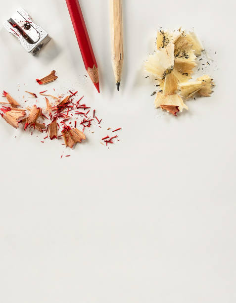 istock Red and simple wooden pencils with shavings and sharpener. 1181821876