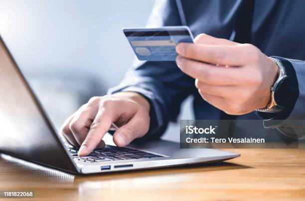Safe Online Payment And Electronic Money Transfer Security Pay With Digital Technology Man Using Credit Card And Laptop To Login To Internet Bank Stock Photo - Download Image Now