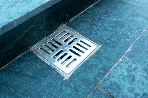 Sewer.Modern poolside water draining system