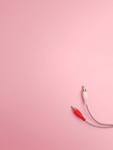 istock wires with audio input plugs on a pink background 1181823021