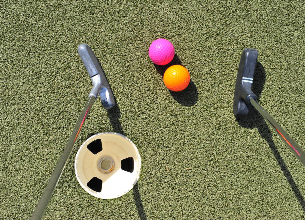 istock Two sticks and colorful ball for mini golf playing, top view 1181823541