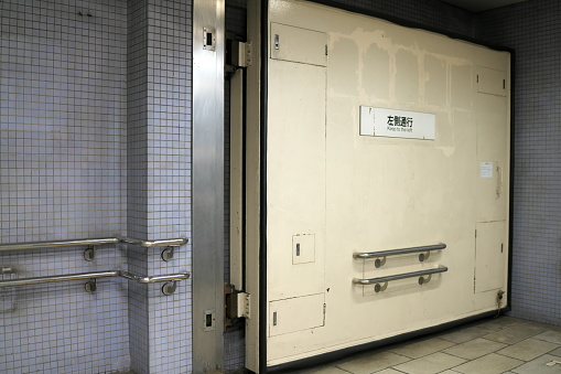Aichi,Japan-September 11, 2019: A watertight door at staircase of Nagoya City subway