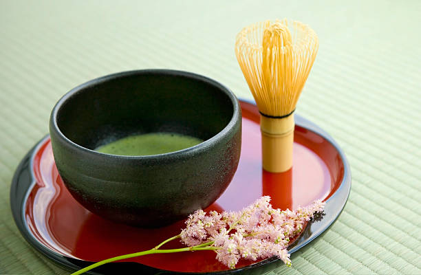 Japanese green tea arrangement on a decorative red plate stock photo