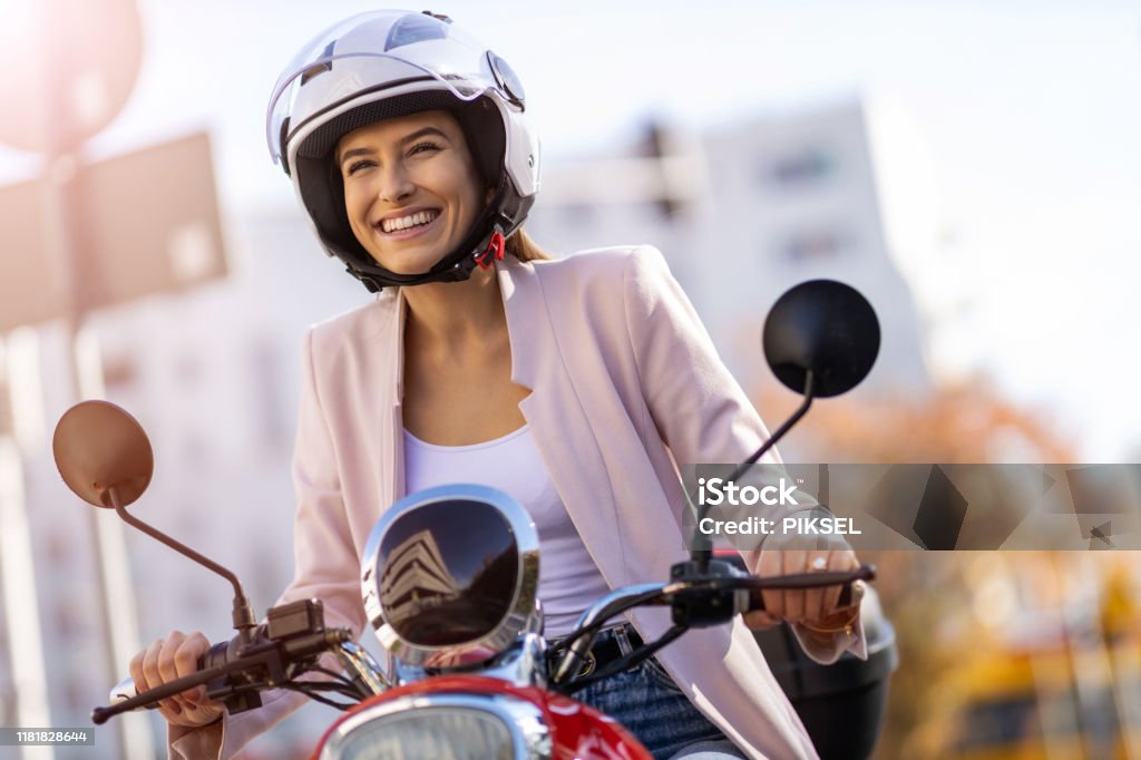 Woman Riding Scooter In The City Motorcycle Stock Photo