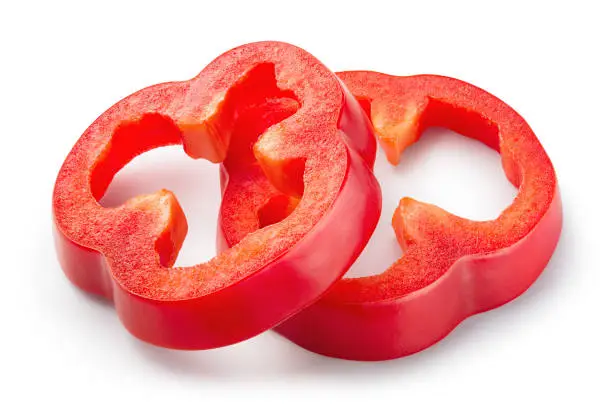 Red pepper slices isolated. Paprika pepper. Cut peppers. With clipping path. Full depth of field.