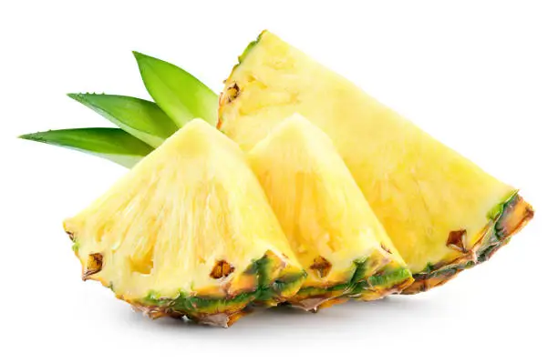 Photo of Pineapple slices with leaves. Pineapple isolate. Cut pineapple on white.