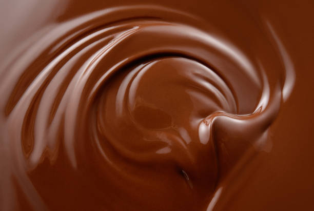 istock Chocolate background. Melted chocolate surface. Chocolate swirl. 1181828741