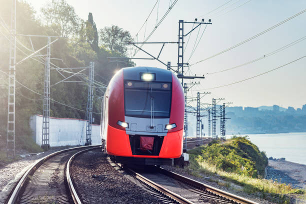 istock Modern high-speed train moves along the Black sea coast. 1181828868