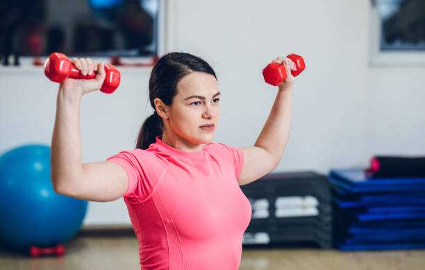 istock Young woman in a gym 1181829131