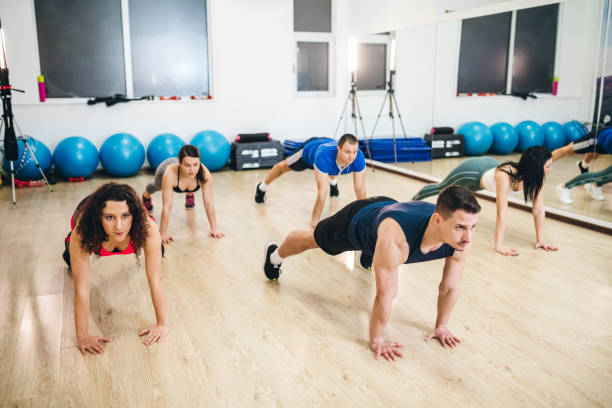 istock Group of people exercising in a gym 1181830042