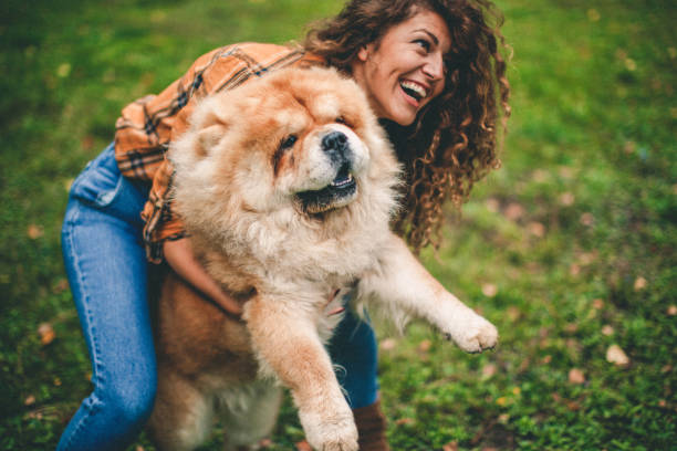 istock Woman with her dog 1181830676