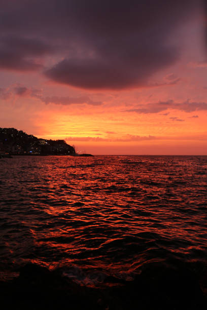 istock Sun goes down over the sea 1181830995