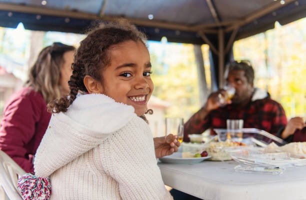 istock Mixed raced family at the cabin, having a picnic 1181834480