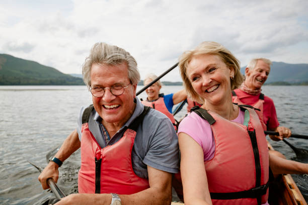 istock Mature Couple Enjoying Rowing On Water 1181841149