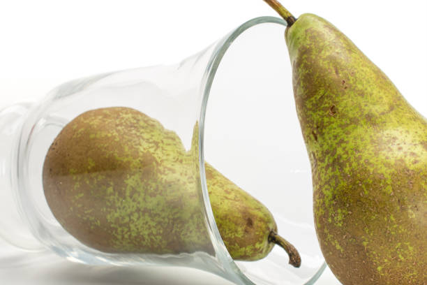 istock Fresh green conference pear isolated on white 1181841562