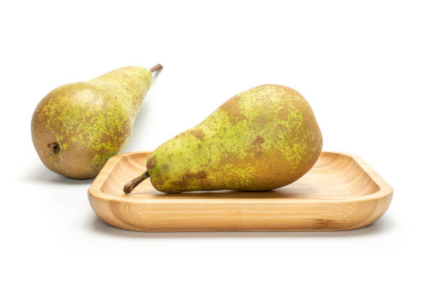 istock Fresh green conference pear isolated on white 1181841593