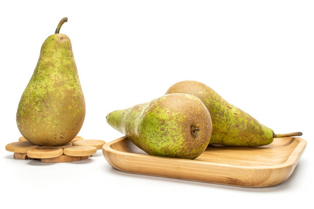 istock Fresh green conference pear isolated on white 1181841654