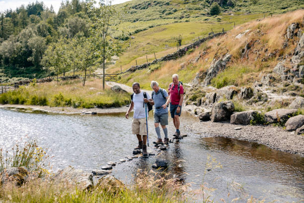 istock Senior Men Crossing River 1181841943
