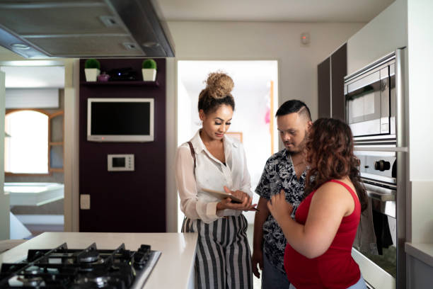istock Special needs couple visiting a house with a real estate agent 1181843748