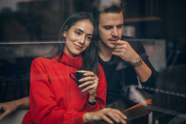 istock Modern couple relaxing in cafe together 1181843790