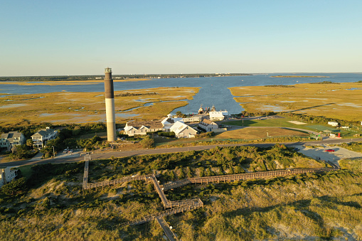 View of Oak Island Lighthouse at Oak Island. Intercoastal Waterway behind.