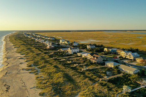 View of beach houses along the coast line at Oak Island North Carolina