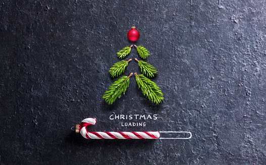 Christmas Loading Concept - Tree And Candy Canes On Black Stone